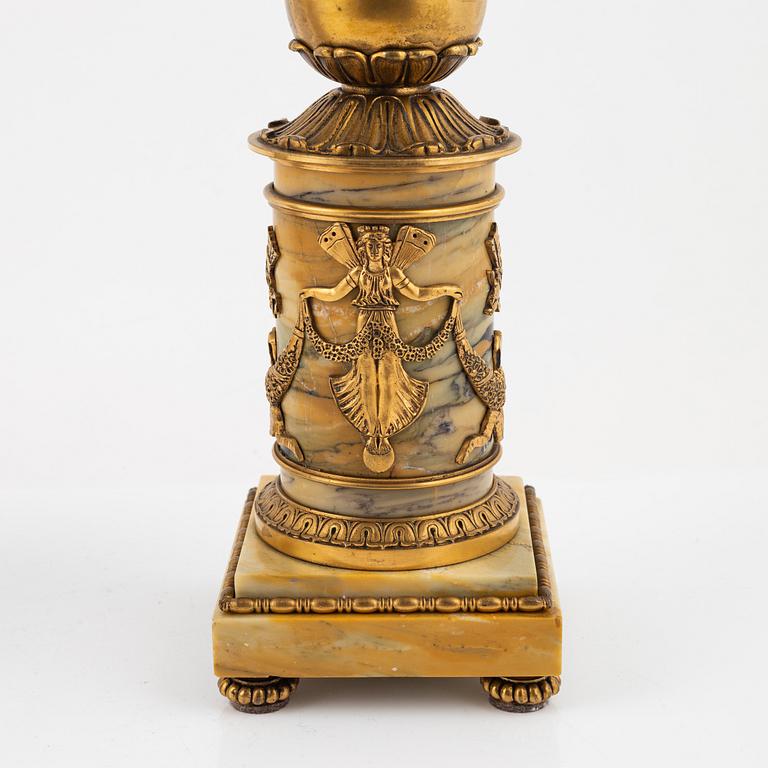 A pair of Empire-style ormolu and marble four-light candelabra, late 19th century.