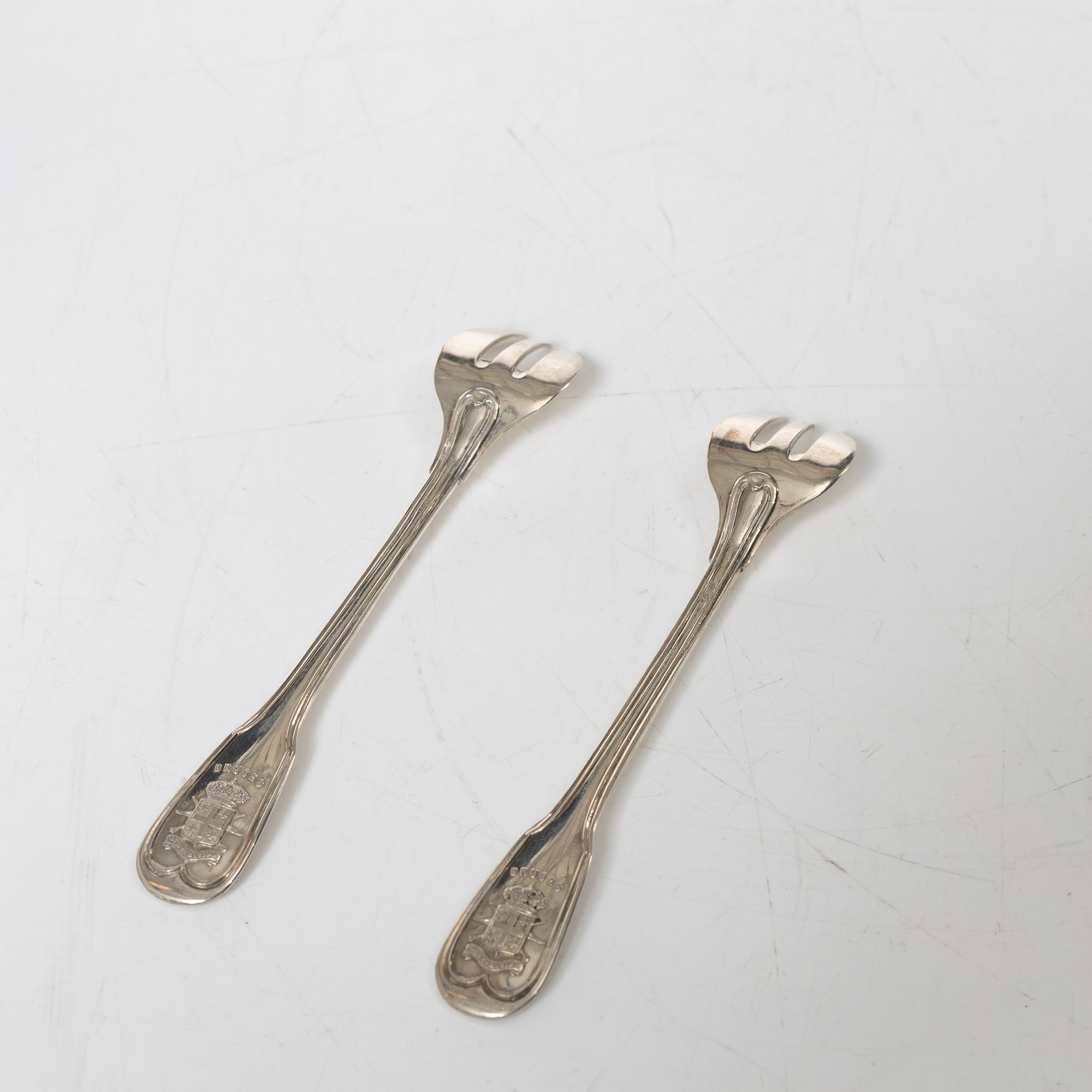 Ostrich forks, 12 pcs, silver 800, 20th Century.
