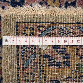 A semi-antique Kerman carpet, figural, c. 371 x 285 cm.