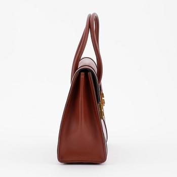 HERMÈS, a brown leather handbag.