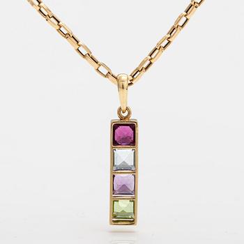 An 18K gold necklace with a garnet, peridote, amethyst and topaz.