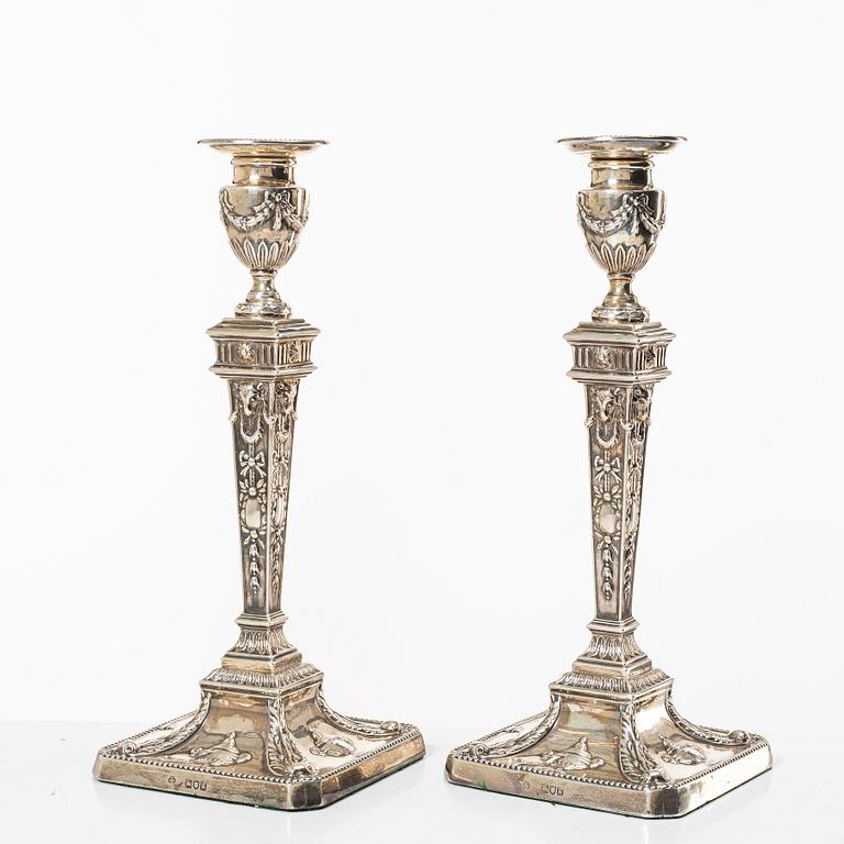 A pair of English silver candlesticks, mark of William Hutton & Sons Ltd, London 1902.