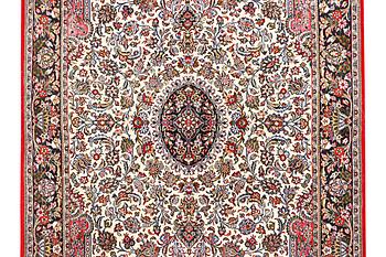 A Quum rug, c. 204 x 134 cm.