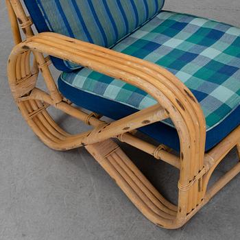 A pair of bamboo and rattan easy chairs, second half of the 20th Century.