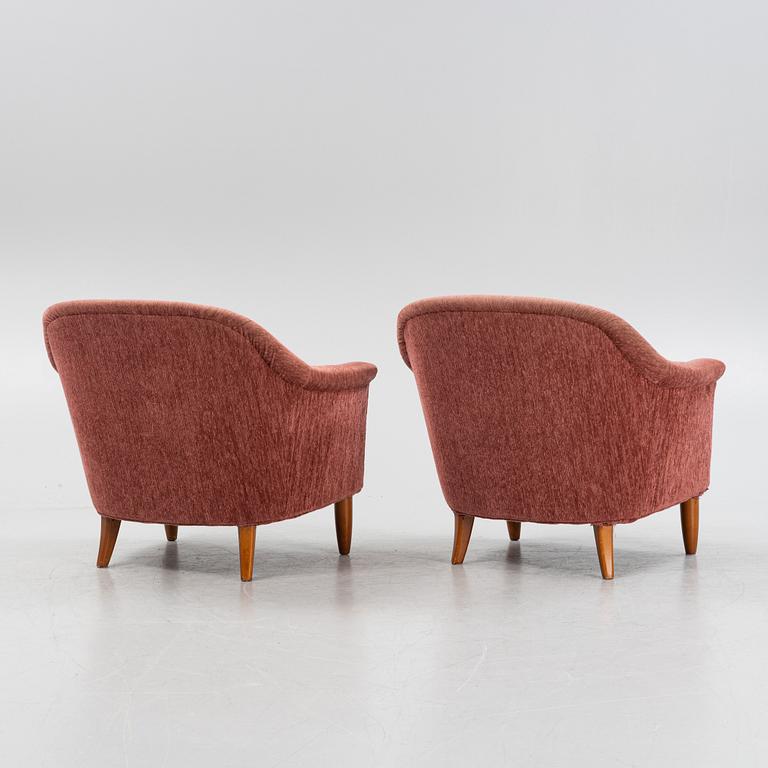 A pair of 1960s easy chairs.