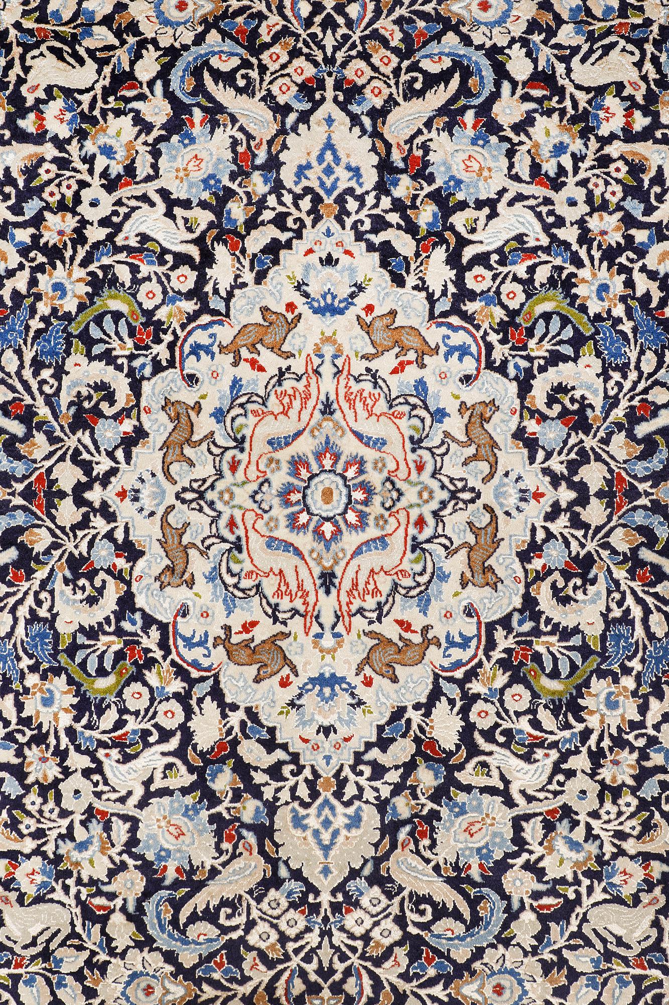 A Nain carpet, part silk, so-called 6 LAA, approx. 324 x 210 cm.