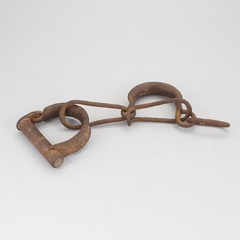 A pair of 1800s handcuffs.