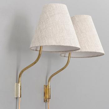 A pair of mid-20th century '3053' wall lights for Stockmann Orno, Finland.