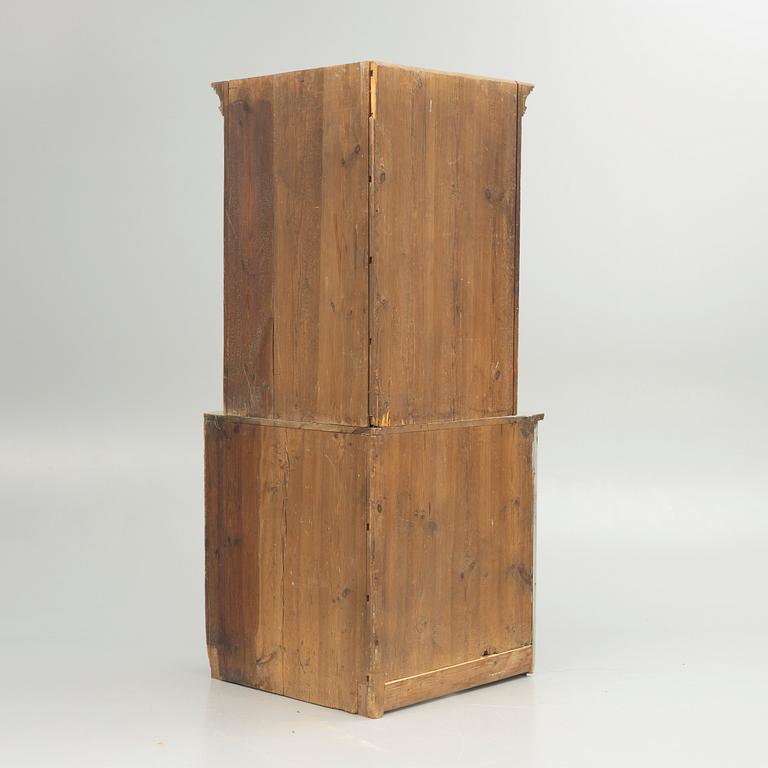 A 19th century corner cabinet.