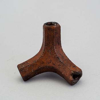 A 19th century pottery folk art candle stick.
