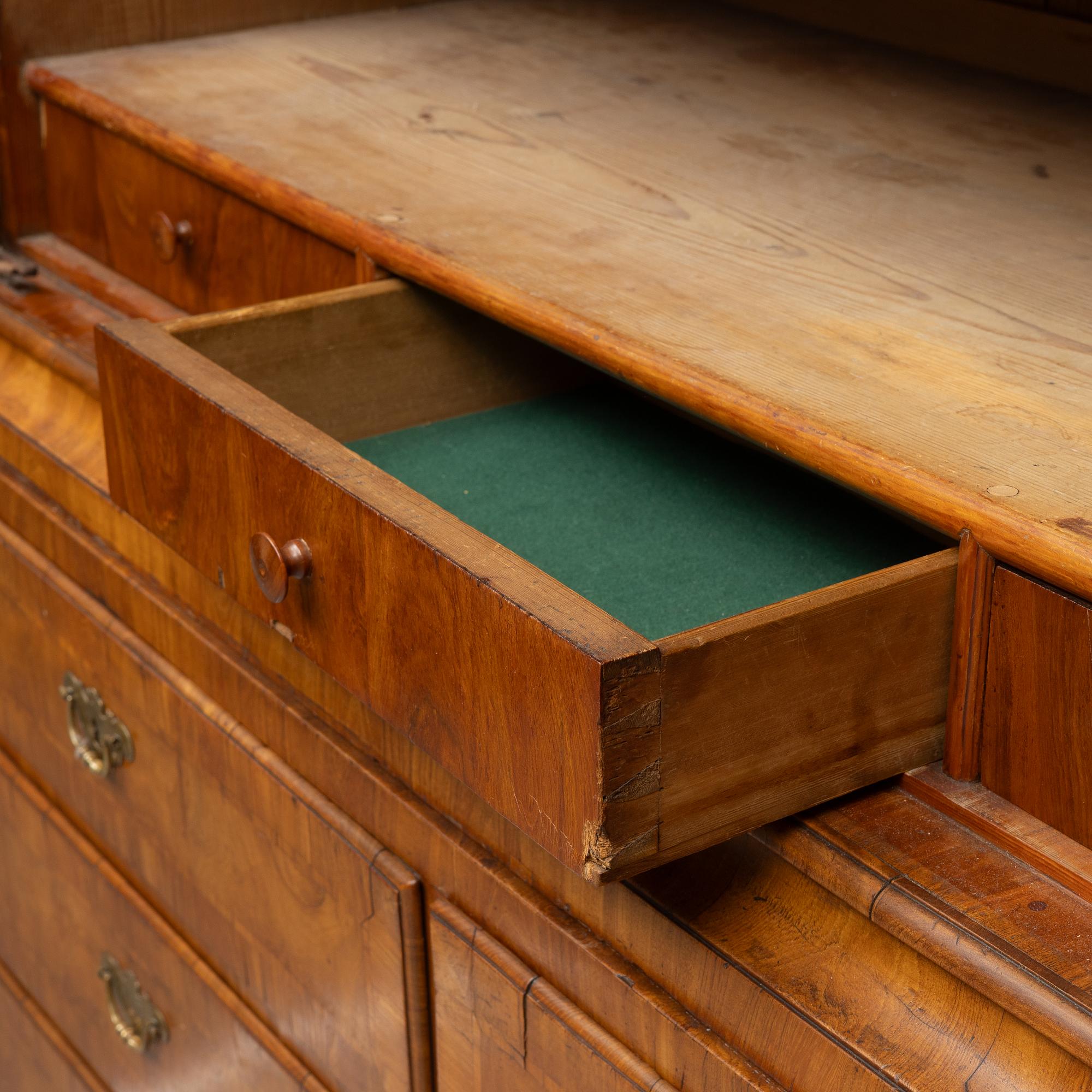 A late Baroque walnut-veneered cabinet in the manner of J. H. Fürloh, mid 18th century.