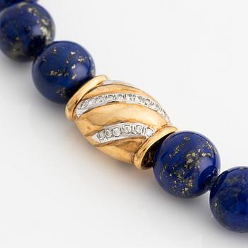 Lapis lazuli necklace with 18K gold clasp and round brilliant-cut diamonds.