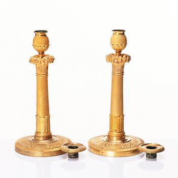 A pair of French Empire candlesticks, early 19th century.