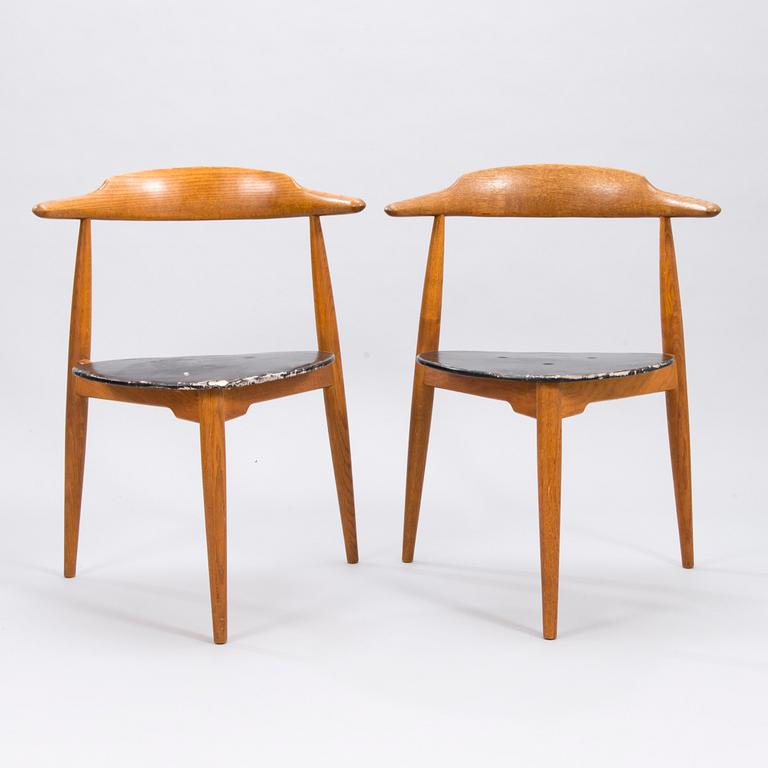 A pair of "Hjertestolen" by Hans J Wegner produced for Fritz Hansen.