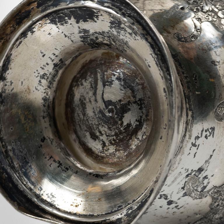 A Persian silver pitcher with five stemmed cups and a beaker, first part of the 1900s.