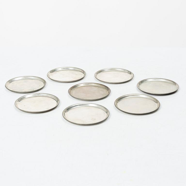 Eight coasters, silver 900, 20th century.