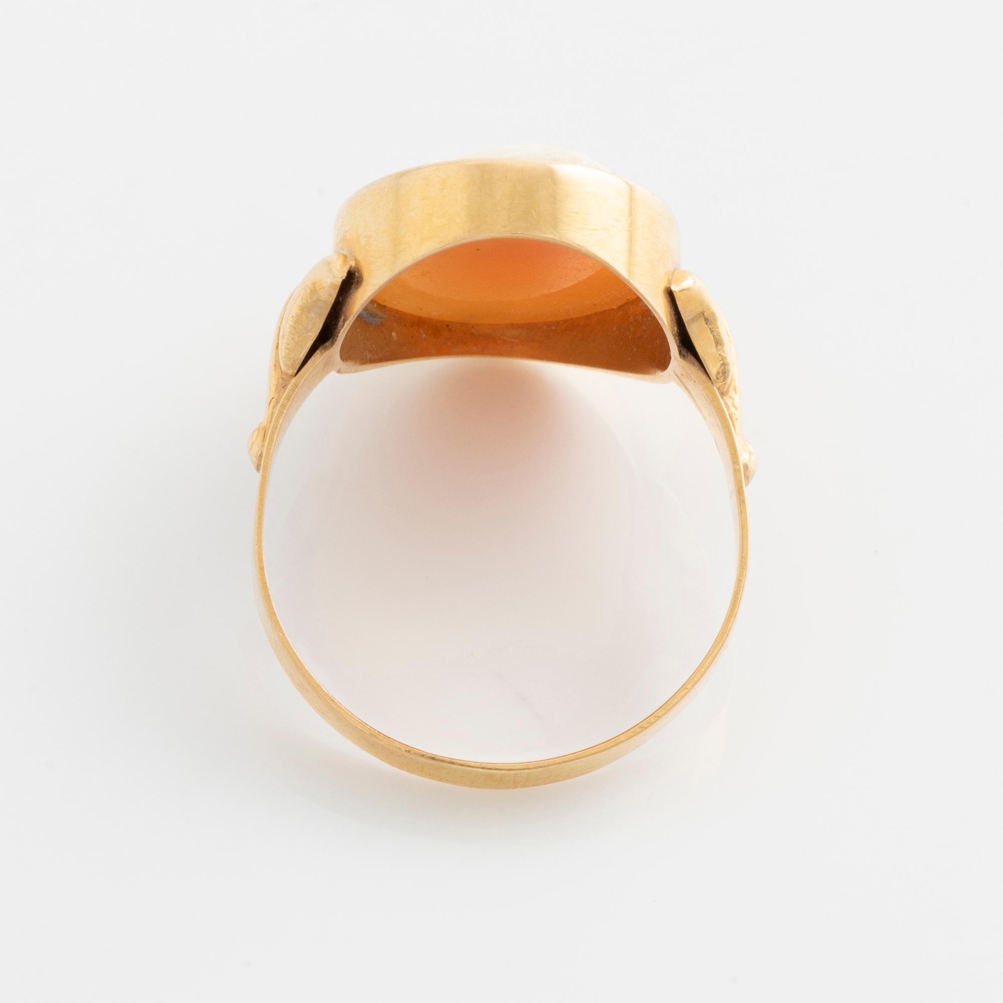 A demi-parure in 18K gold with sea shell cameos.