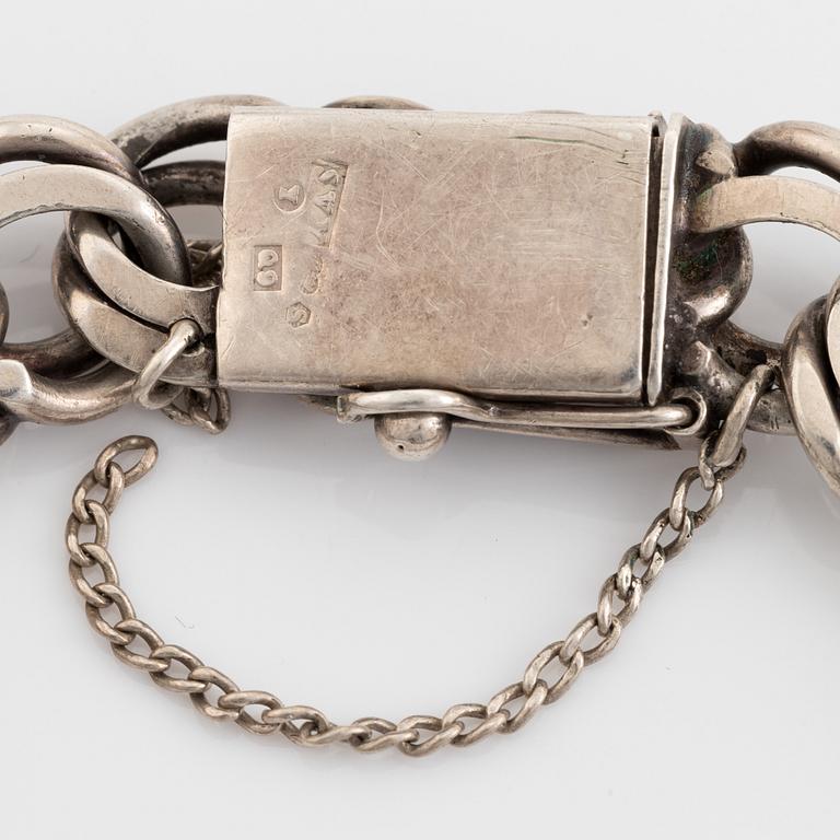 Silver bracelet.