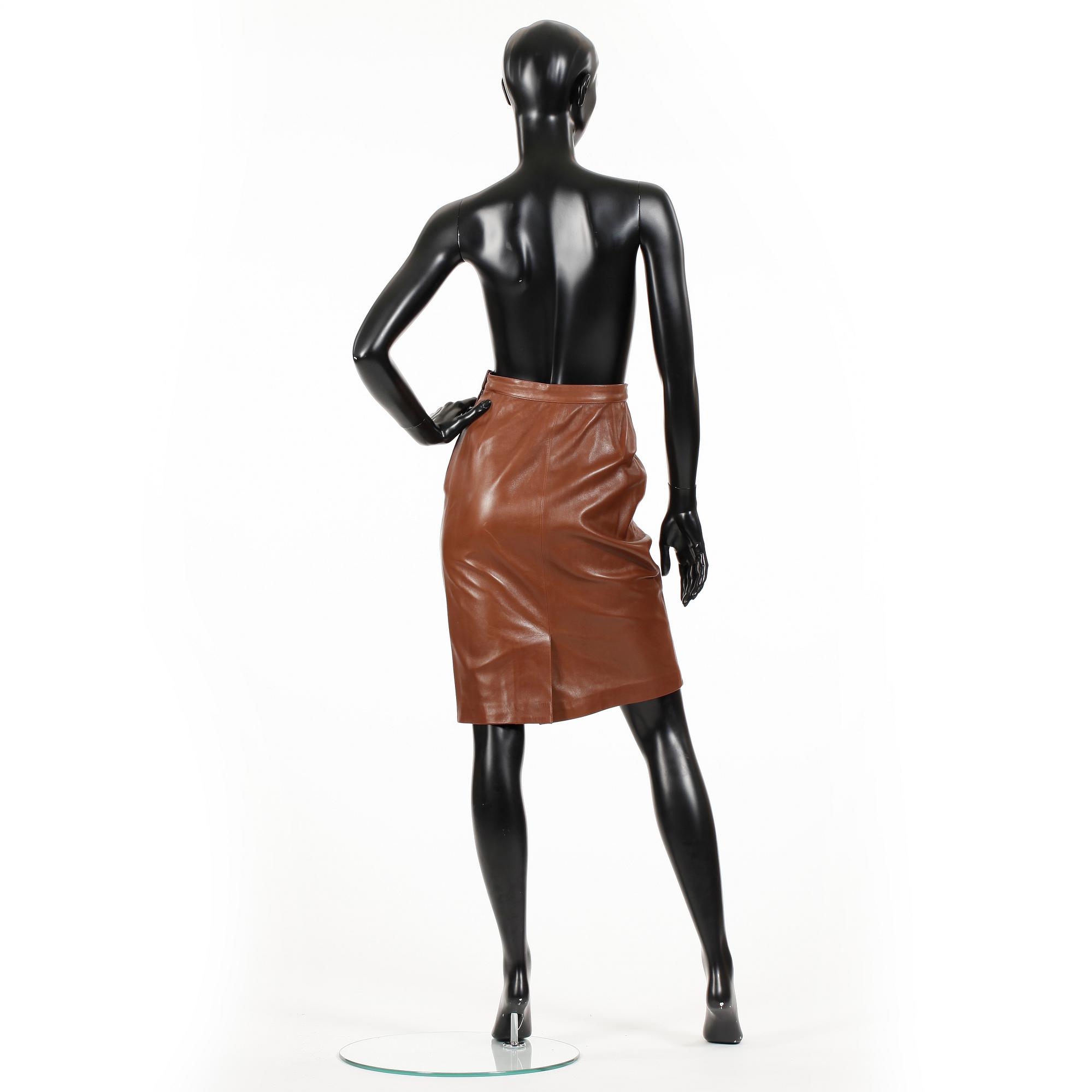 YVES SAINT LAURENT, a brown leather skirt.