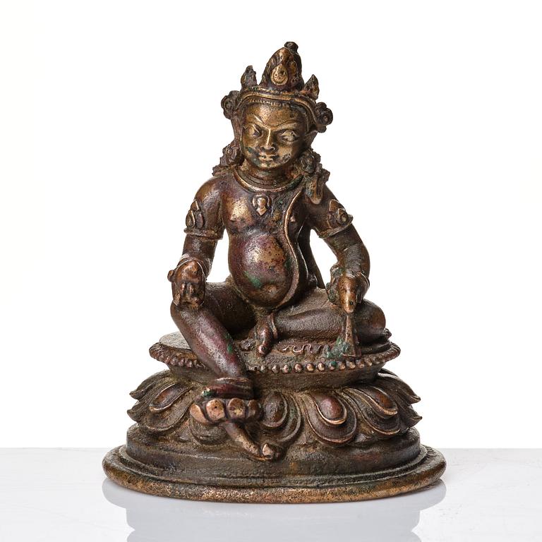 A copper alloy figure of Jambhala, Nepal, possibly 12/13th Century.