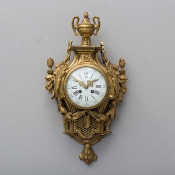 A brass wall clock marked A.W. Bruuns eftr, Lund from around year 1900.