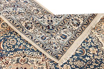 A Nain carpet, part silk, 9 laa, c. 300 x 189 cm.