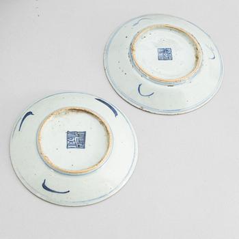 A set of 12 similar Chinese blue and white porcelain small dishes, late Qing dynasty, around the year 1900.