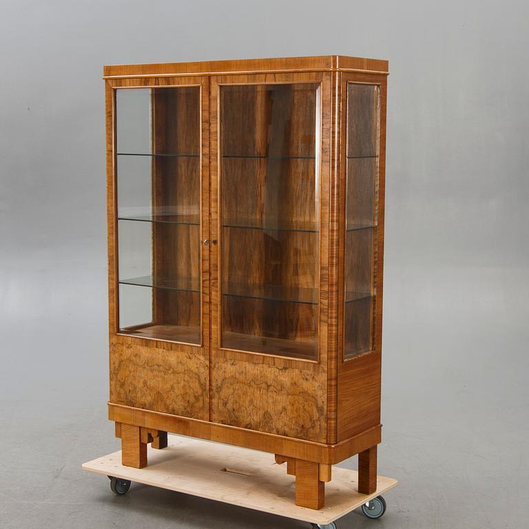 A walnut 1930740s display cabinet.