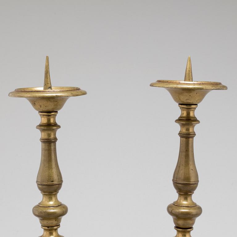 A pair of 17th century bronze candlesticks.