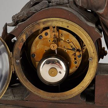 A large bronze mantle clock, circa 1900.