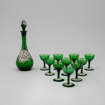 An eleven-piece pewter decorated glass service, first half of the 20th Century.