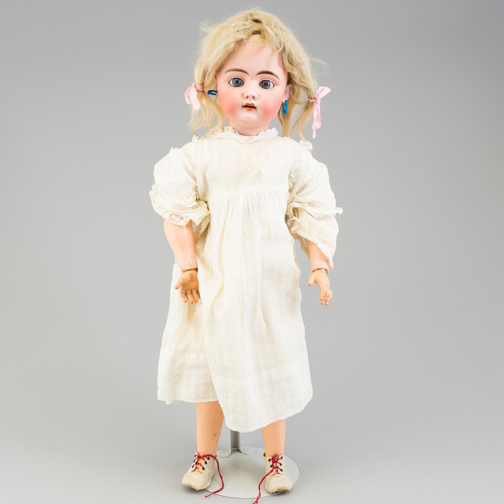 a porcelain doll from the 1920 s. Bukowskis