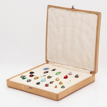 A collection of 24 egg pendants in original wooden box, Russia, early 20th century.