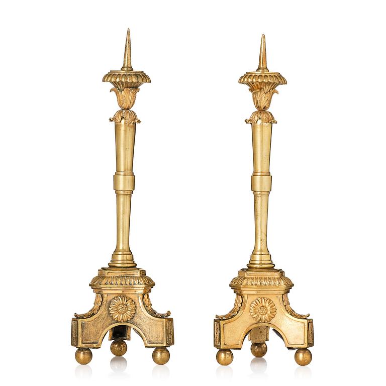 A pair of presumably Italian Empire ormolu candlesticks, early 19th century.