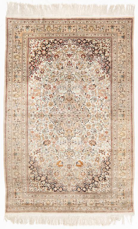 A silk Ghom rug, c. 185 x 122 cm.