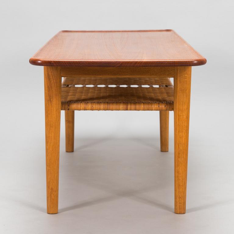 An oak and tek coffee table by Hans J Wegner for Andreas Tuck, 1960s.