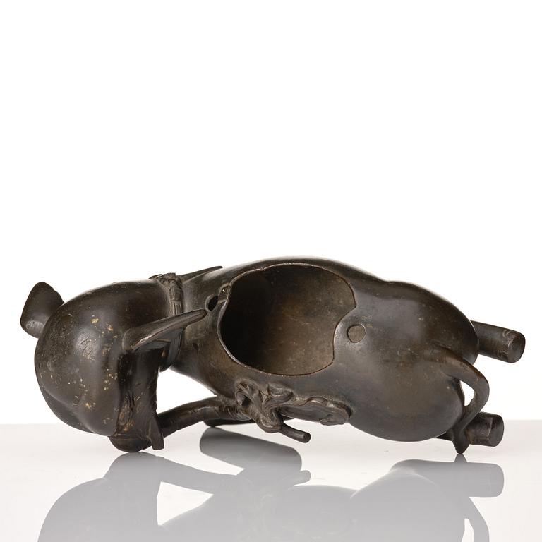 A bronze figure/censer of a reclining elephant, Qing dynasty, 19th Century.