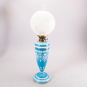 A glass paraffin lamp around 1900.