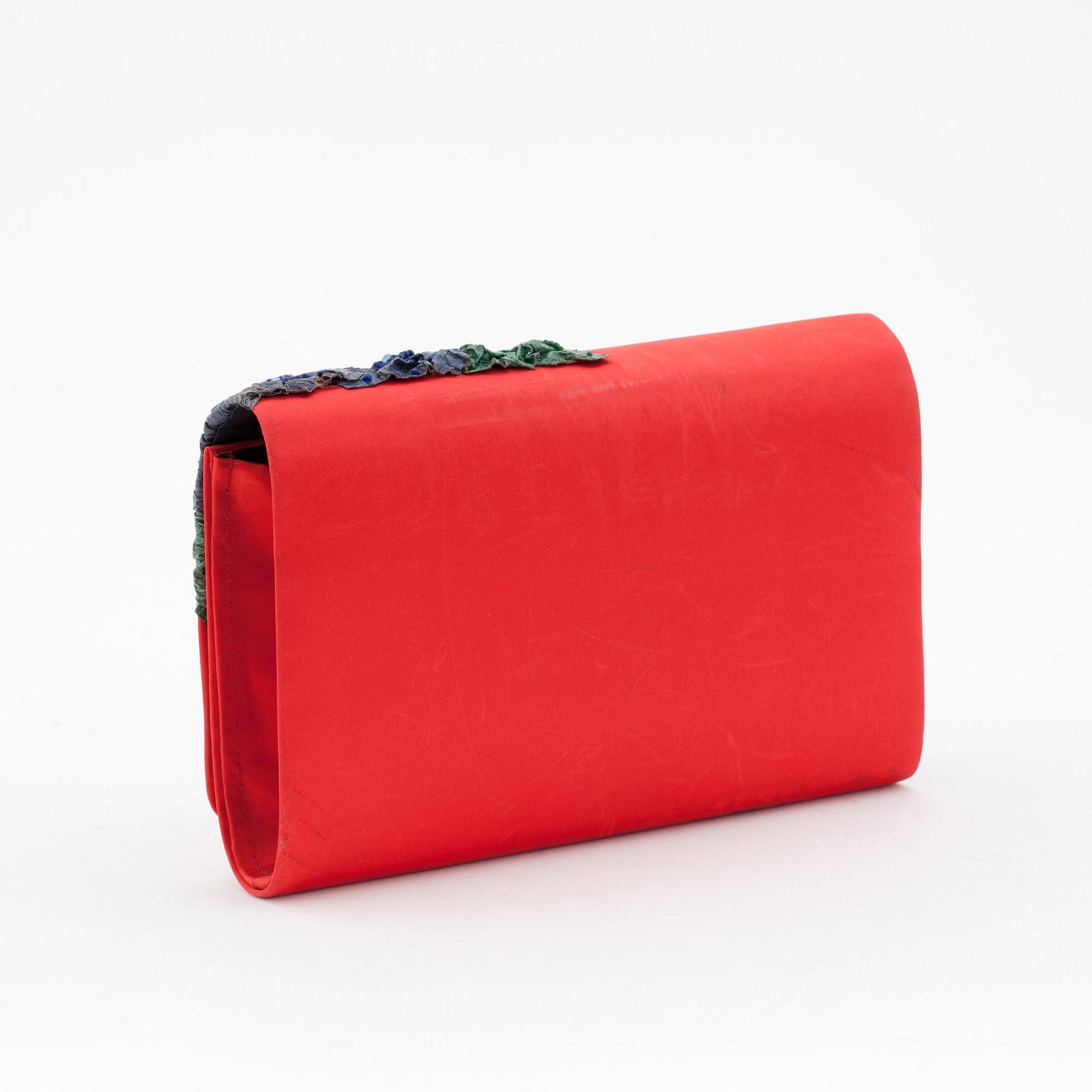 CORA JACOBS, a red silk and embossed leather clutch / evening bag.
