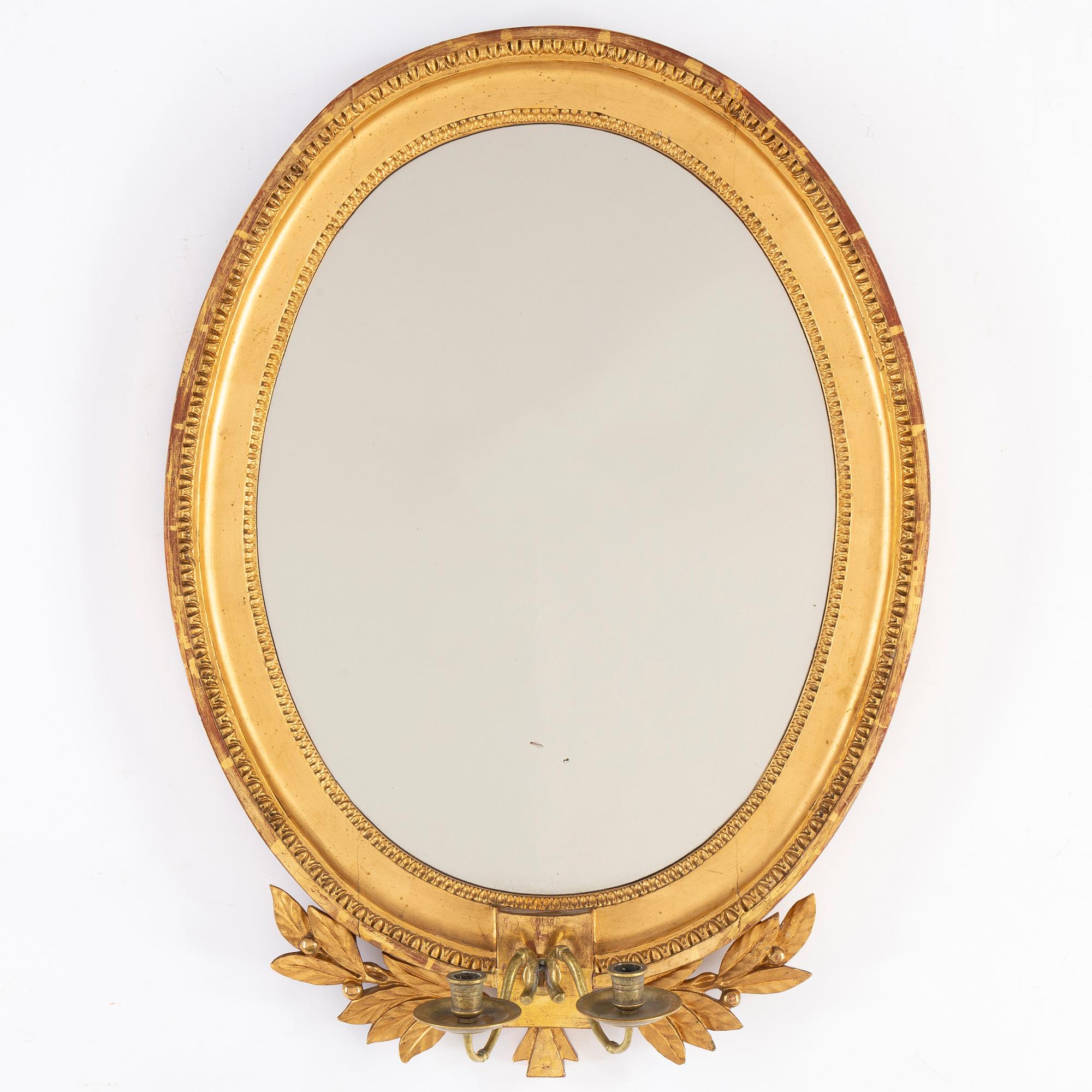 A late Gustavian two-light girandole mirror, circa 1800.