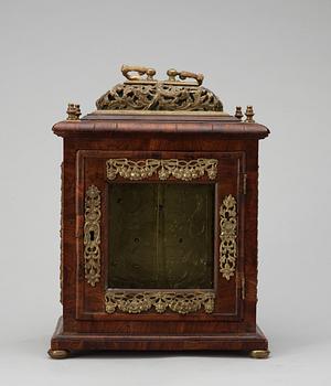 A Queen Anne early 18th century brass-mounted walnut striking table clock by Jacobeus Markwick.