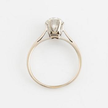 A 14K gold ring set with a round brilliant-cut diamond.