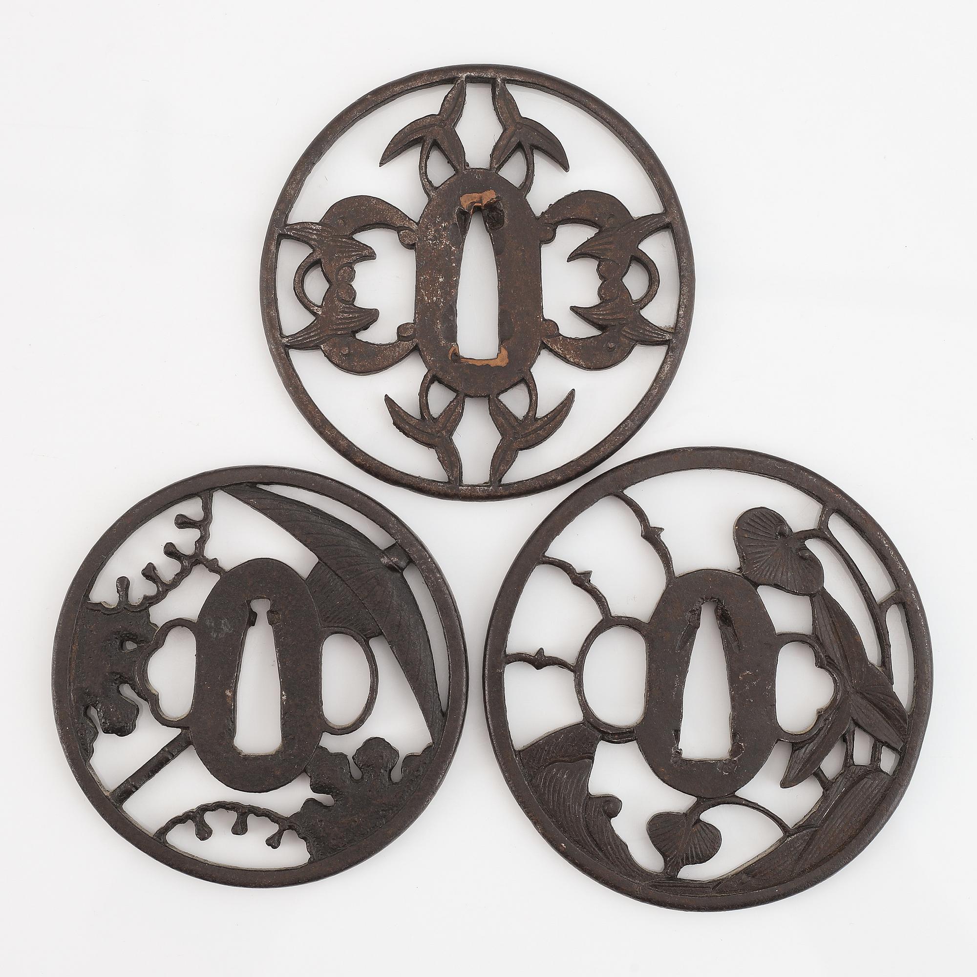 Three Japanese iron tsubas, probably 18th Century.