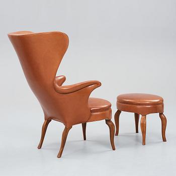 Frits Henningsen, an oak highback chair and ottoman, Denmark 1940's.