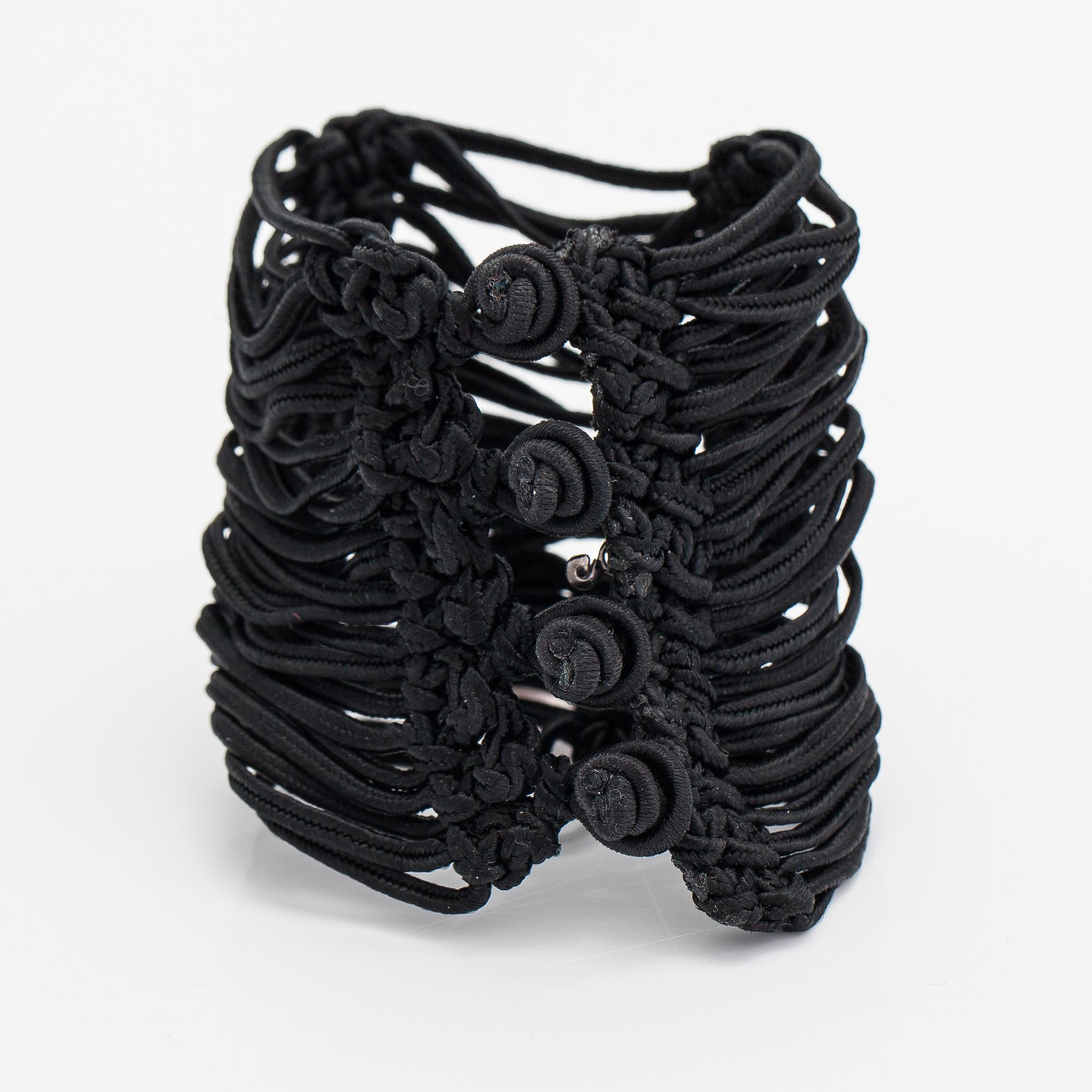 Ole Lynggaard, A satin like band bracelet with an 18K white gold and rose quartz "Sweet drops" pendant.