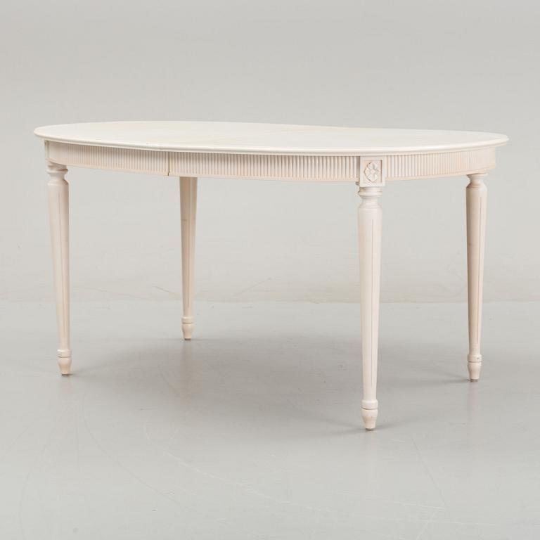 A dining table with eight chairs and a stool, Gustavian style, second half of the 20th Century.