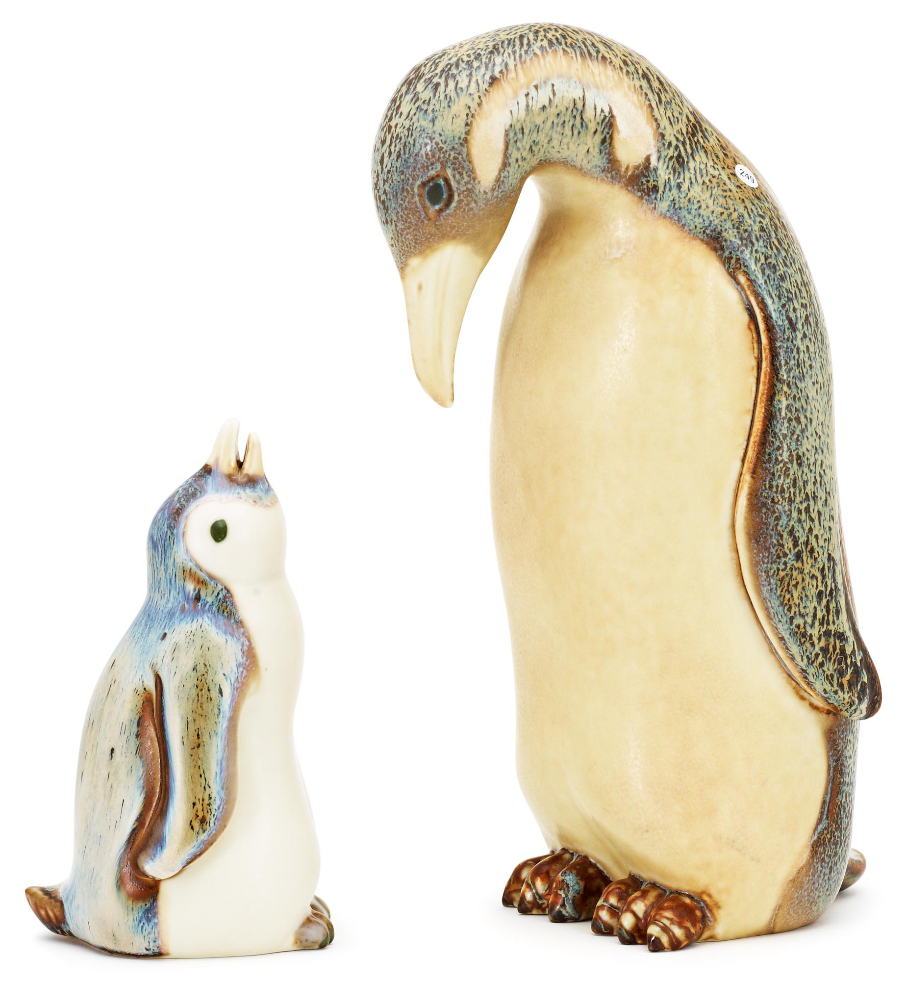 Two Gunnar Nylund stoneware figures depicting a penguin mother with child, Rörstrand.