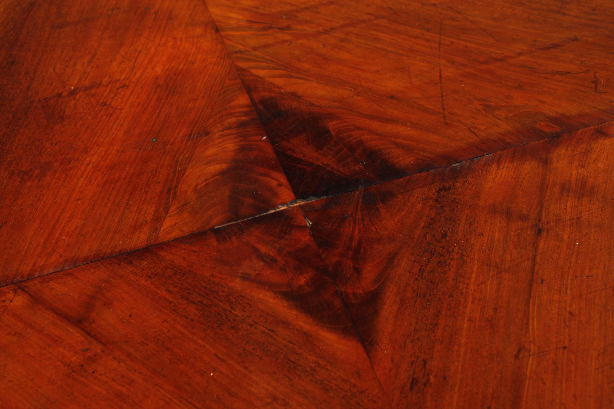 A late 19th century table with two extension leaves.