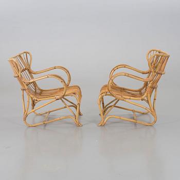 A mid 20th century ratten lounge chairs.