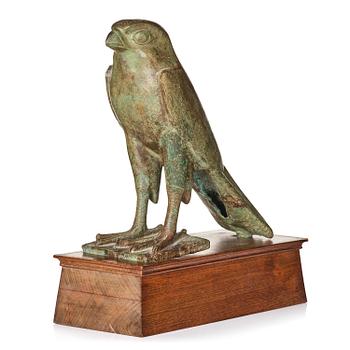190. A fine and large Egyptian bronze figure of Horus the falcon, presumably late period Dynasty XXVI, (663-525 B.C.).
